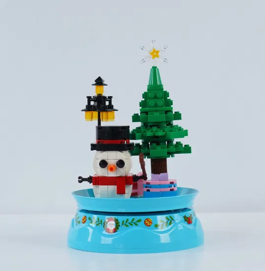 Woma Toys Venta al por mayor Personalizar niños Regalos de cumpleaños de Navidad Modelo de hombre de nieve Caja de música giratoria coleccionable DIY Juego de bloques de construcción de ladrillos pequeños Juego de bricolaje